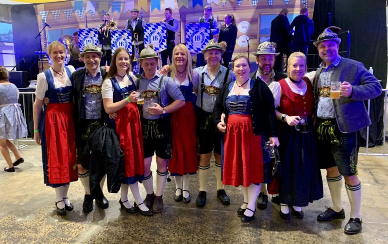 Club dancers in dirndls and lederhosen on stage