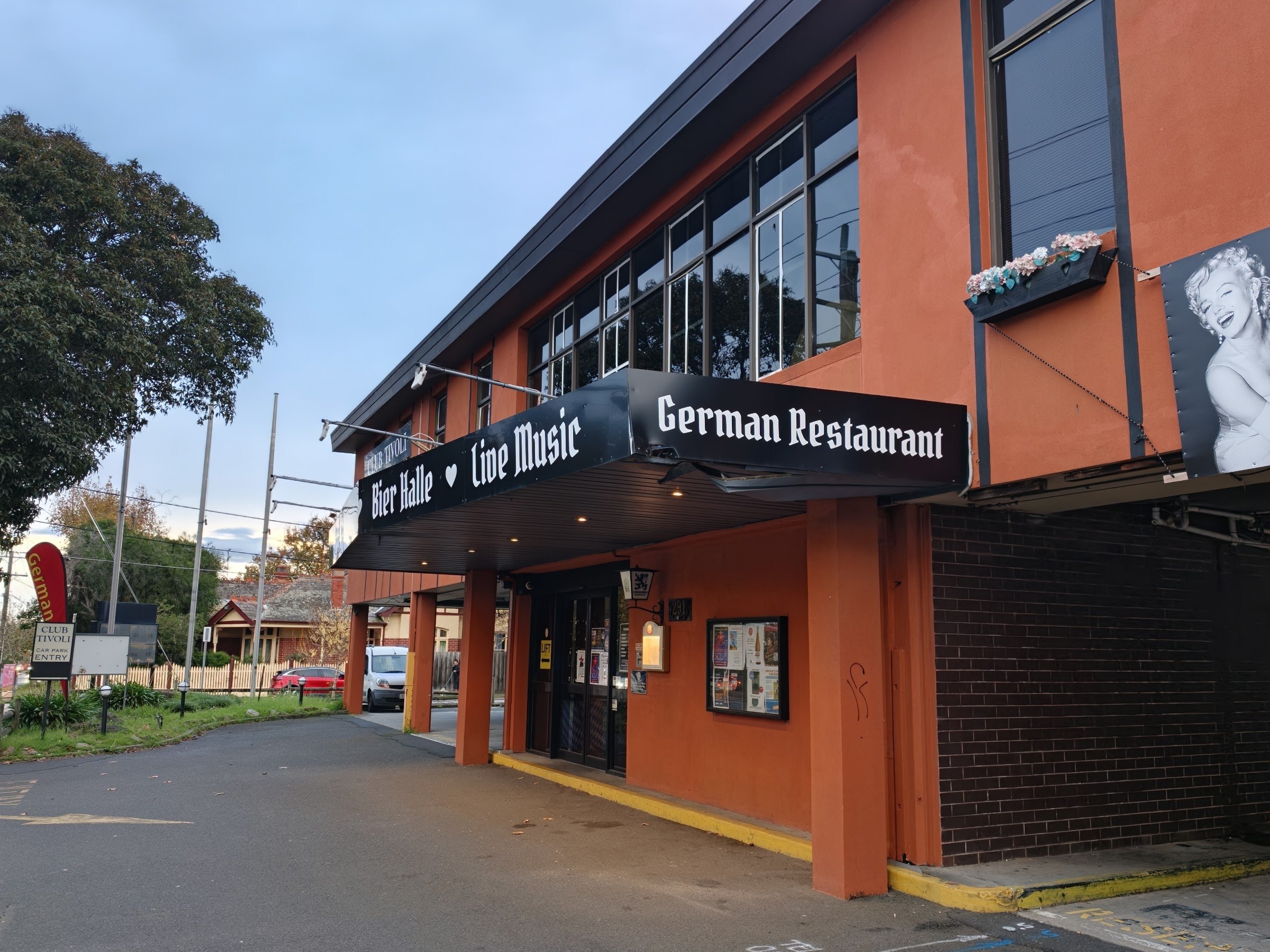 The orange clubhouse on Dandenong Road with its black German Restaurant and Bier Halle awning