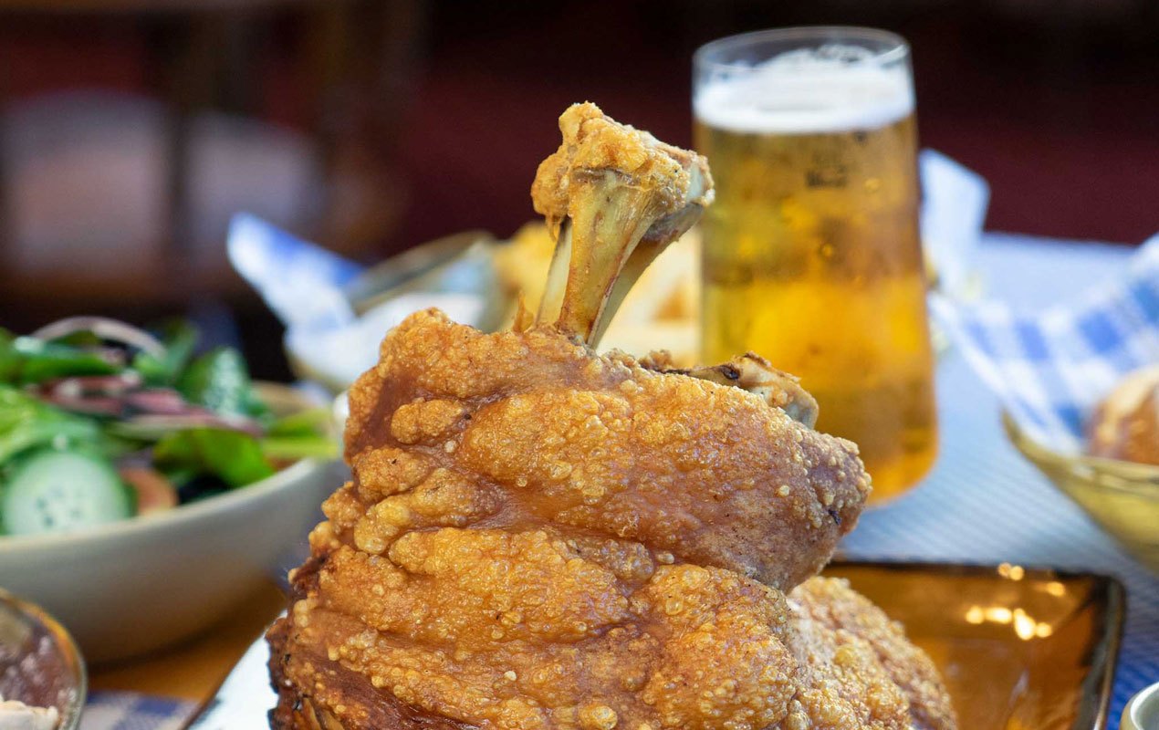Slow roasted pork knuckle with a beer